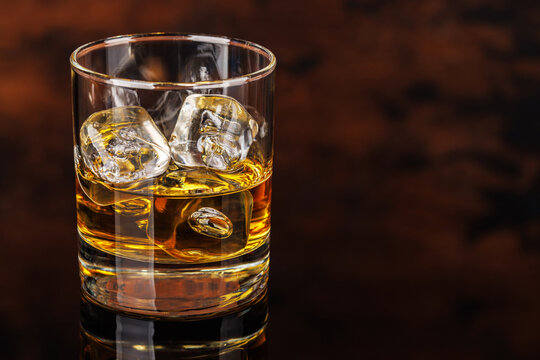 Glass of whiskey with ice