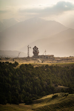 View of the Suffa Radio Observatory structure with construction cranes set against the backdrop of the mountains, Zaamin, Jizzakh Region, Uzbekistan.