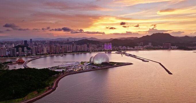 Scenic sunset over the city skyline and modern waterfront buildings in Zhuhai, China
