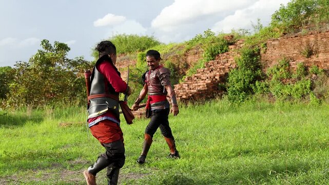 Ancient Thai Warriors Engaged in Traditional Sword Combat at Ruins
