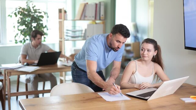 Woman while working at computer gets emotionally abused by boss. Male head of department is dissatisfied with quality of work, is outraged by unsatisfactory competence of employee