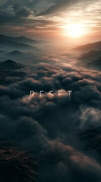 Drifting clouds glide over calm mountains at sunrise as glowing minimal typography &ldquo;RESET&rdquo; forms from soft mist, gently dissolves, and reforms in a seamless atmospheric loop.