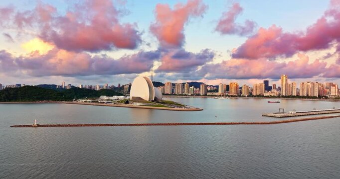 Scenic sunrise over the city skyline and modern waterfront buildings in Zhuhai, China
