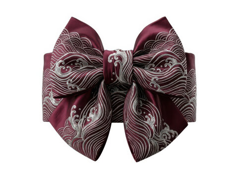 Decorative fabric bow with traditional japanese wave pattern in red and black colors