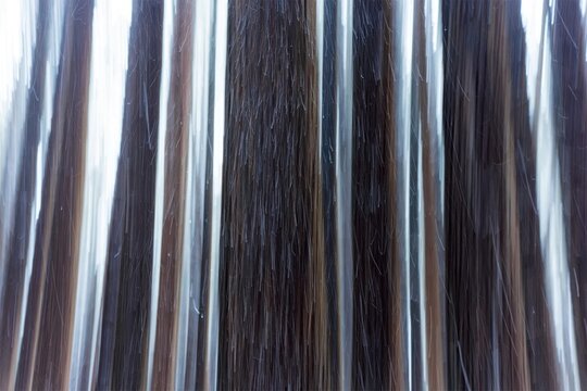 Close-up of metal wires or cables hanging vertically