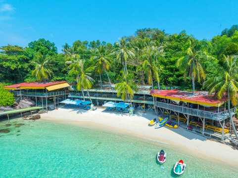 Aerial view of beautiful landscape, tourism boats, and people swimming on the sea and beach on May Rut and Mong Tay island in Phu Quoc, Kien Giang province, Vietnam