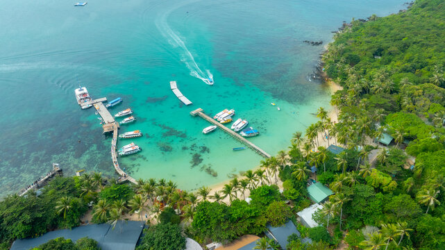 Aerial view of beautiful landscape, tourism boats, and people swimming on the sea and beach on May Rut and Mong Tay island in Phu Quoc, Kien Giang province, Vietnam