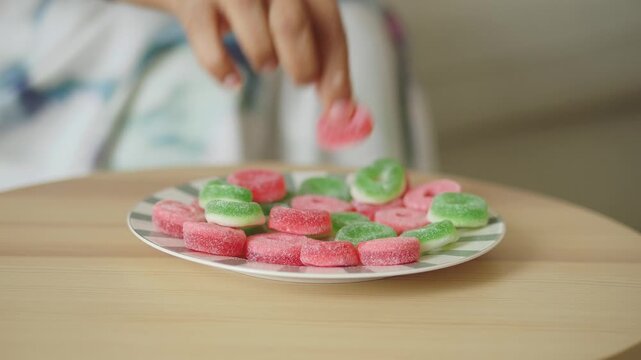 Enjoying candy on a wooden table