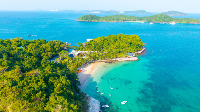Aerial view of beautiful landscape, tourism boats, and people swimming on the sea and beach on May Rut and Mong Tay island in Phu Quoc, Kien Giang province, Vietnam