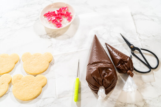 Cookie decorating setup with piping bags and tools