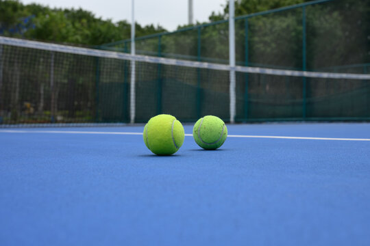 Two tennis balls on the tennis court