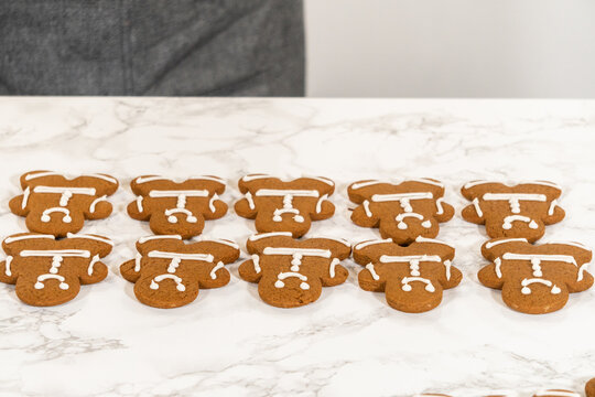 Decorating Gingerbread Man Cookies with Royal Icing for Festive Occasions