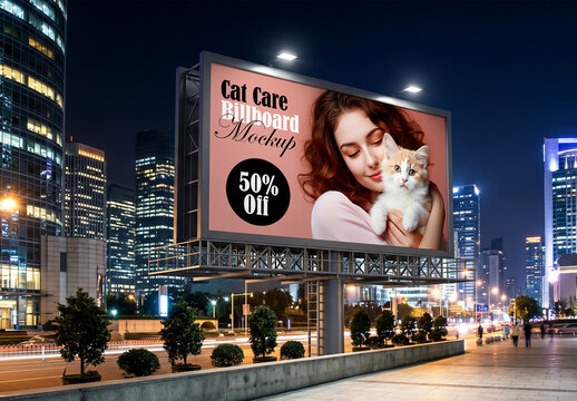 Large outdoor billboard mockup in city center at night