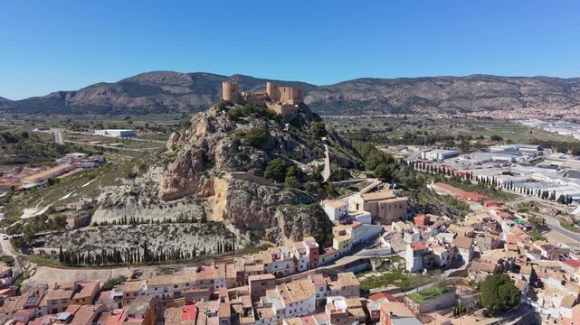 Drone fly past of Castalla Castle and the surrounding mountain town in Spain.