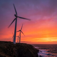 Obraz premium Wind Turbines on Coastal Cliff at Sunset for Renewable Energy