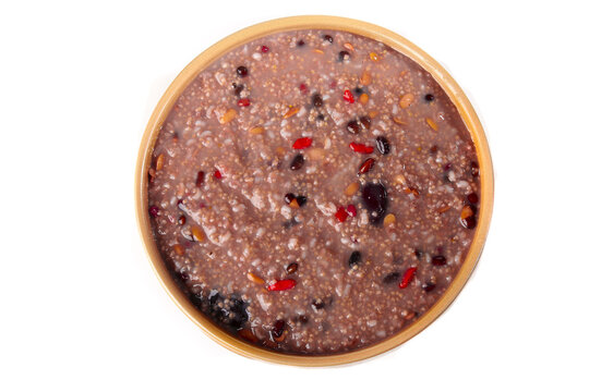 Healthy Mixed Grain Congee Porridge with Beans and Nuts in Wooden Bowl - Nutritious Breakfast Meal