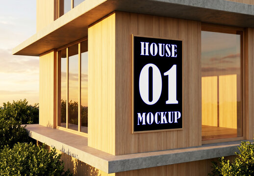 Vertical poster mockup on modern wooden house exterior wall