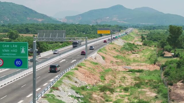 Aerial Drone View of Cam Lam Vinh Hao Expressway Through Mountain Landscape in Vietnam