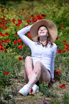 Female legs with visible psoriasis plaques in natural environment. Chronic skin inflammation, dermatological disorder, treatment, body care and living with autoimmune disease concept.