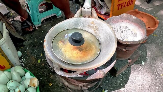Kerak telor is a dish from the Betawi (Jakarta, Indonesia), consisting of an omelet mixed with white glutinous rice, dried shrimp, and spices.