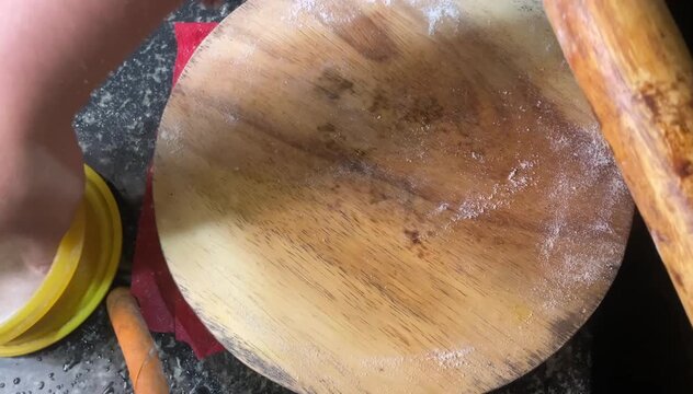 rolling round roti bread
