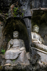 Obraz premium HangZhou, China, the stone statue the eighteen Arhats made in Northern Song DynastyPeak Flown From Afar Fei Lai Fen, Ling Jiu Feng , stands next to Lingyin Temple