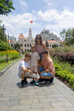 Family with children, boys, visiting Ho Chi Minh city, Saigon, fot a holiday, enjoying asian culture