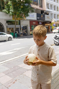 Family with children, boys, visiting Ho Chi Minh city, Saigon, fot a holiday, enjoying asian culture