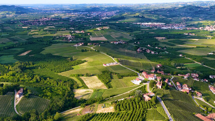 Fototapeta premium Aerial View of Rolling Vineyards and Rural Villages in Piedmont Italy