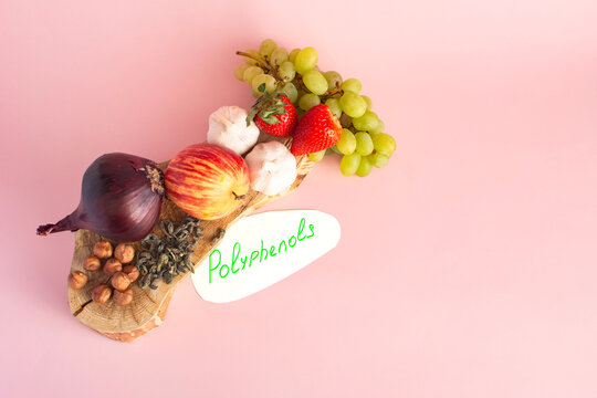 Products containing useful polyphenols in their composition. Grapes, onions, garlic, chocolate, tea close-up on a light background