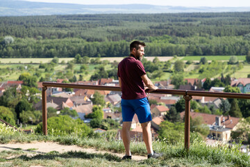Naklejka premium man relaxing on a summer terrace