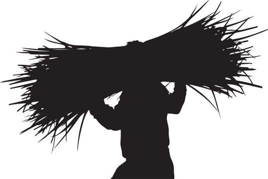 Silhouette of a person carrying a large bundle of sticks