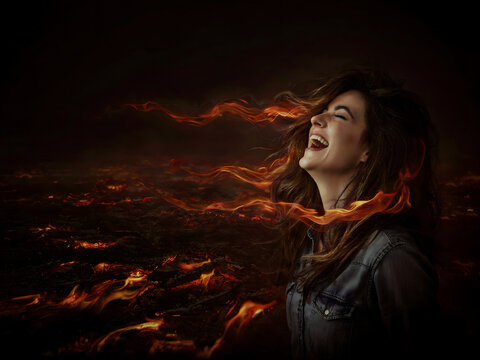 Dramatic portrait of a joyful woman surrounded by intense flames and energy