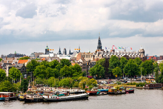 Boats moored at Oosterdok harbor in Amsterdam city center