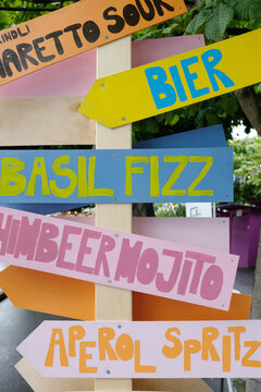 Colorful wooden bar signpost for cocktails outdoors