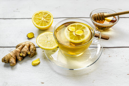 Studio shot of hot tea with ginger, lemon and honey