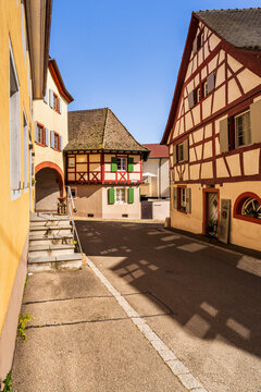 Empty street with historic half timbered houses in Burkheim
