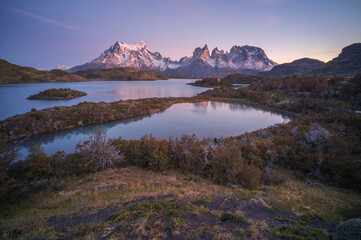 Naklejka premium Patagonia mountain lake at dawn with calm water and snow peak