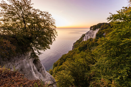 Germany, Mecklenburg-West Pomerania, Ruegen Island, Jasmund National Park, Chalk cliffs and Baltic sea at sunset