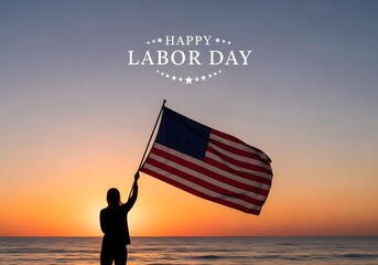 Person holding american flag on beach at sunset for labor day