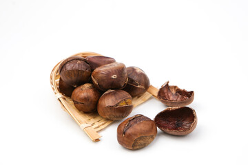 Fototapeta premium Roasted Chestnuts on White Plate