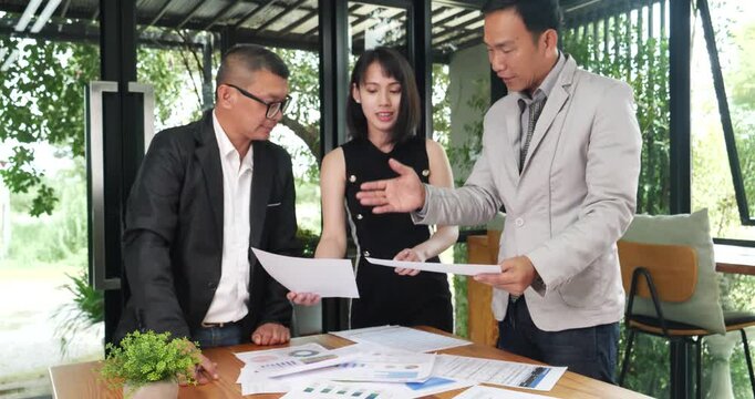 Diversity multiethnic group brainstorming teams with business partner meeting and share ideas in conference room. Team meeting office desk partnership. Office meeting board room Conference Business