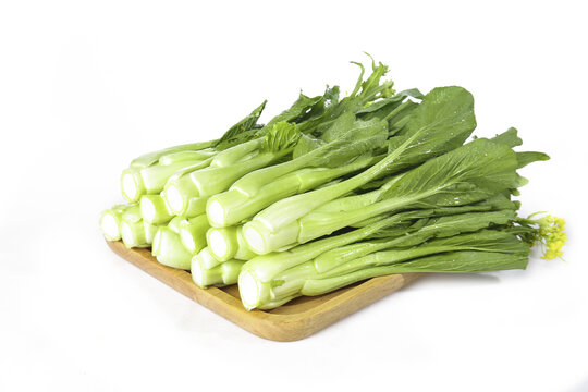 Fresh Baby Choy Sum Chinese Vegetables on Wooden Board - Asian Leafy Greens for Cooking