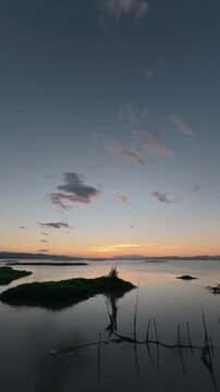 Timelapse of Sunset Over Calm Water with Islands