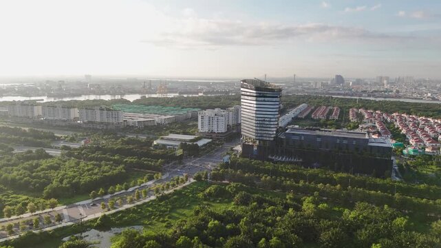 Aerial Drone View of Thisofic Tower, Sala Urban Area and Ho Chi Minh City Skyline at Golden Sunrise, Vietnam