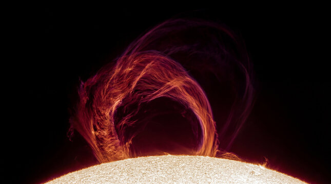 Towering solar prominence arching above the surface of the Sun