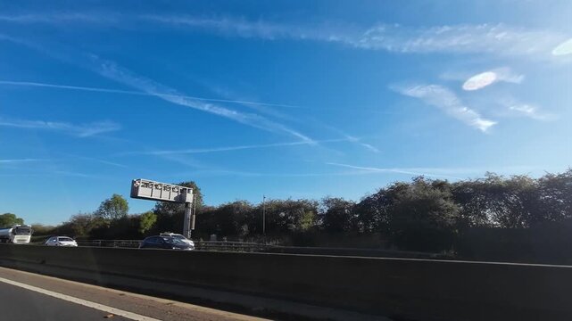 Car Drive on British Highways. Car Mounted Camera Time Lapse Footage of British Road Travel and Traffic During Blue Sky and Mostly Sunny Day Drive on British Motorways and Highways of England UK