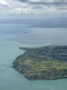 Aerial view of Irish coastal landscape with green hills and ocean, Howth, County Dublin, Ireland, June 2025