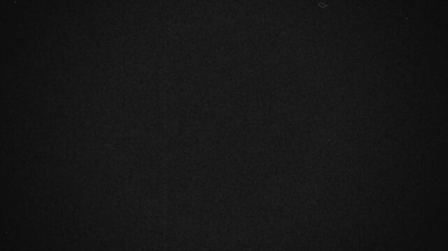 Authentic cinematic celluloid noise overlay with organic dust particles for vintage aesthetics 4k video