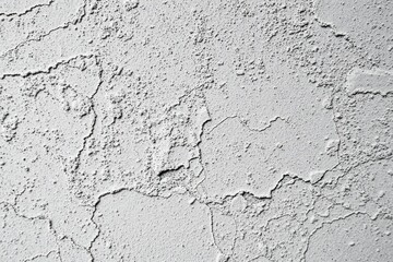 Fototapeta premium Rough texture covers surface. Gray tones dominate image, showing cracks, bumps, imperfections. Minimalist aesthetic.